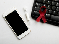 Source: freepik; Copyright: h9images; URL: https://www.freepik.com/free-photo/red-ribbon-mobile-phone-with-white-background-hiv-aids-ribbon-awareness_20112213.htm; License: Licensed by JMIR.