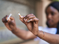 Source: Freepik; Copyright: krakenimages.com; URL: https://www.freepik.com/free-photo/young-african-american-woman-breaking-cigarette-street_57542145.htm; License: Licensed by JMIR.