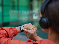 Source: Freepik; Copyright: wayhomestudio; URL: https://www.freepik.com/free-photo/woman-checks-results-fitness-training-smartwatch-listens-music-via-headphones-dressed-anorak-poses-blurred_19046120.htm; License: Licensed by JMIR.