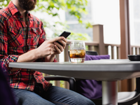 Source: Freepik; Copyright: wavebreakmedia_micro; URL: https://www.freepik.com/free-photo/man-using-mobile-phone-bar_8405882.htm; License: Licensed by JMIR.