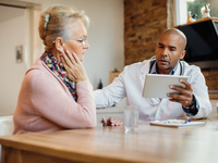 Source: Freepik; Copyright: Drazen Zigic; URL: https://www.freepik.com/free-photo/african-american-doctor-using-touchpad-while-talking-senior-woman-nursing-home_26768690.htm; License: Licensed by JMIR.