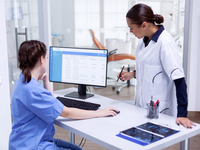 Source: Freepik; Copyright: DC Studio; URL: https://www.freepik.com/free-photo/stomatolog-nurse-tooth-clinic-checking-patient-appointment-looking-computer-monitor-stomatology-assistant-teeth-doctor-discussing-reception-dental-office_17437513.htm; License: Licensed by JMIR.