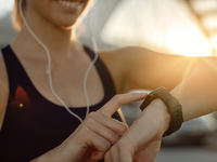 Source: Magnific; Copyright: Drazen Zigic; URL: https://www.magnific.com/free-photo/closeup-athletic-woman-using-fitness-tracker-sunset_26608244.htm; License: Licensed by JMIR.